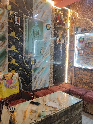 Burn and Build reception area with marble walls and trophies